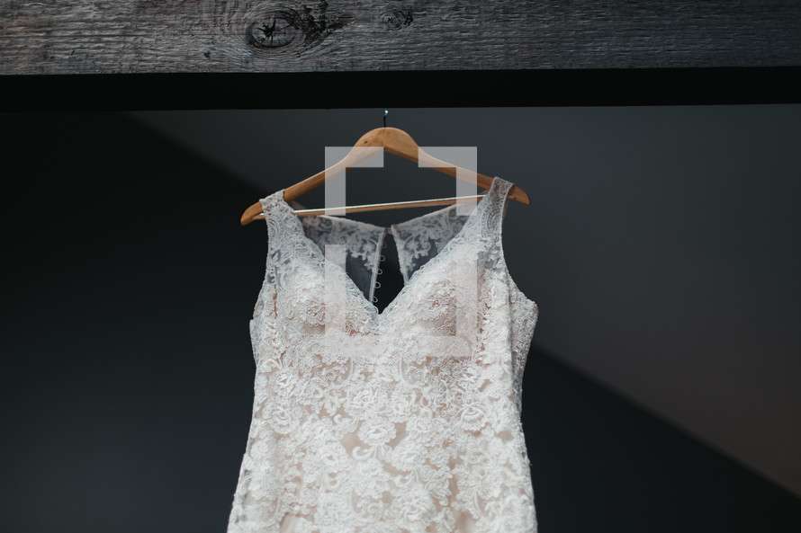 wedding dress on a hanger 