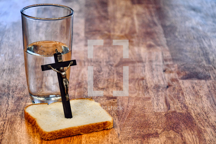 bread and water on a kitchen table -  Lenten fasting