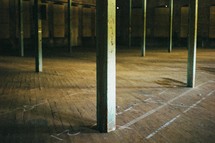 floor and posts in an abandoned warehouse 