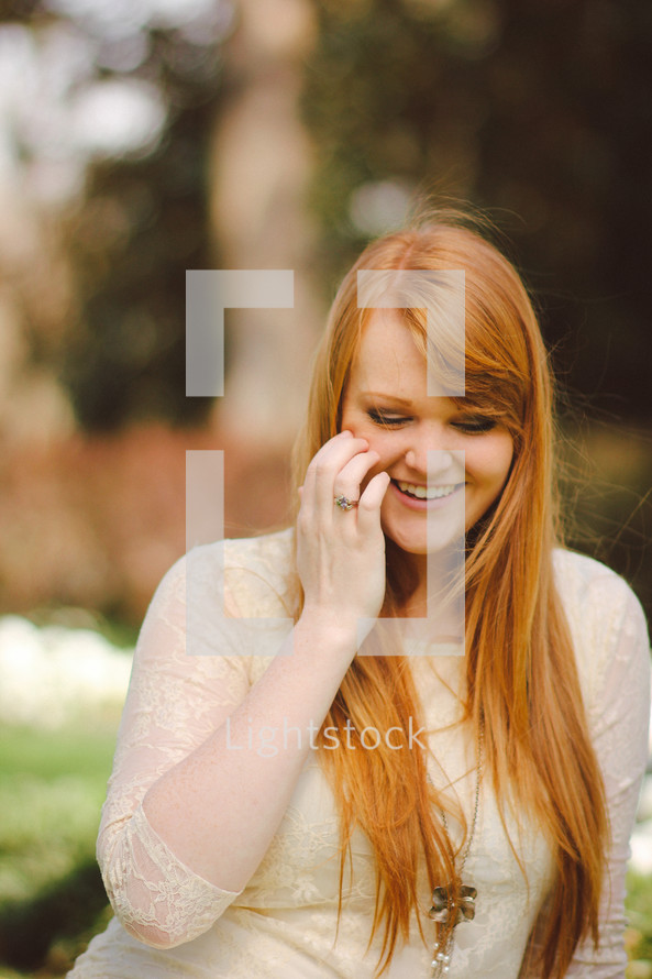 woman touching her face 