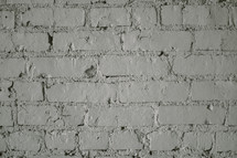 A brick wall painted white. 
