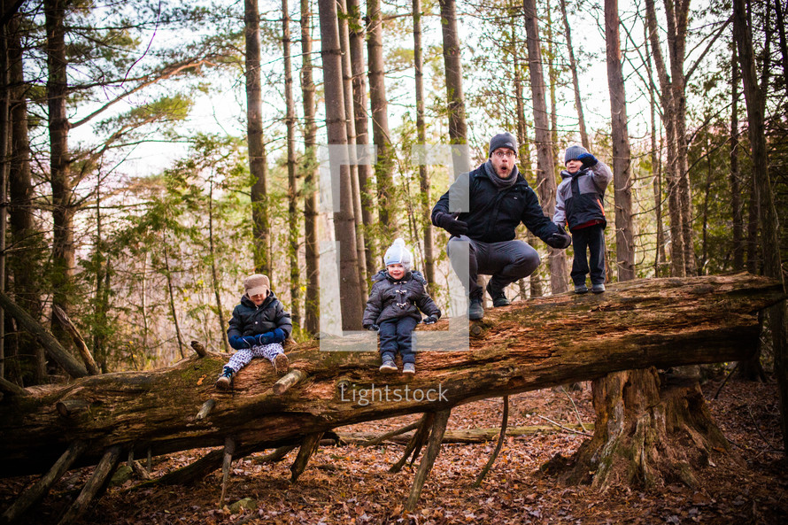 a family exploring the woods 