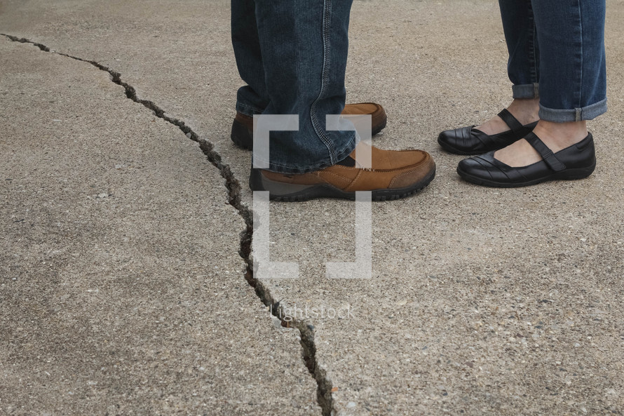 couple standing by a crack 