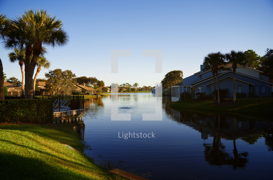 View on suburb district with pond and palm trees. Florida, USA