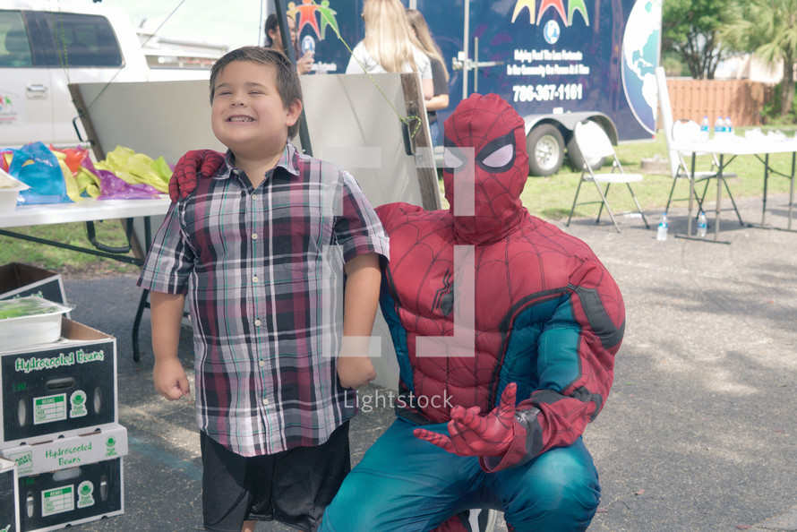 little boy posing with Spiderman