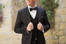 a groom in a tuxedo 