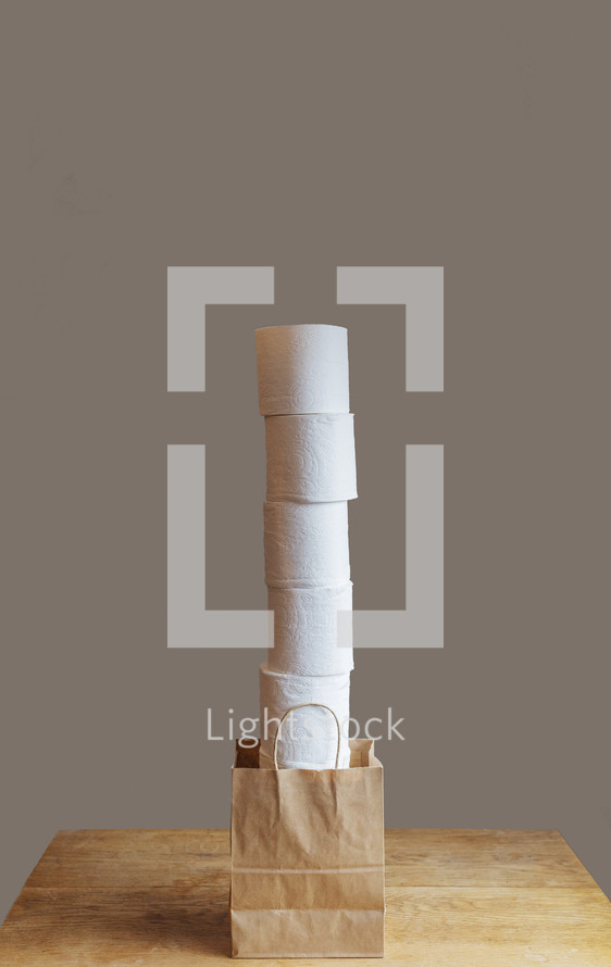 tall stack of toilet paper rolls