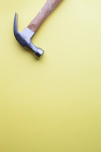 Hammer on a yellow background.
