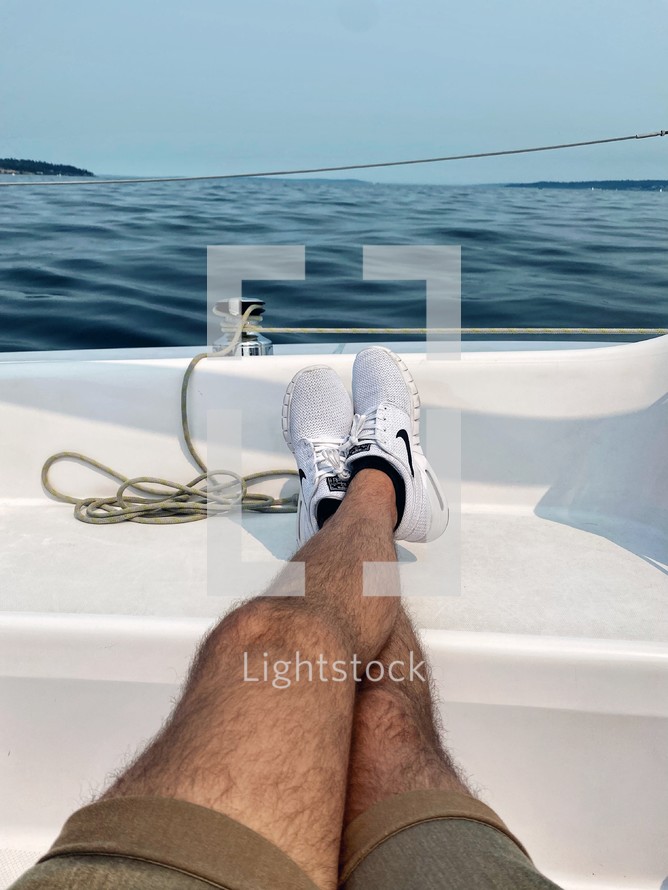 man relaxing on a boat 