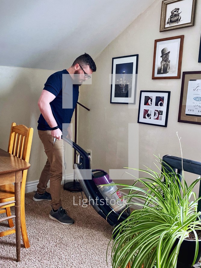 a man vacuuming 