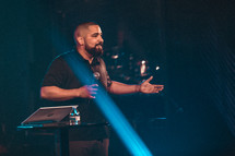 man with a microphone on stage 