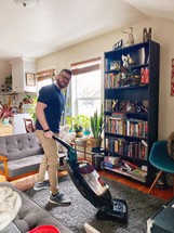 a man vacuuming 
