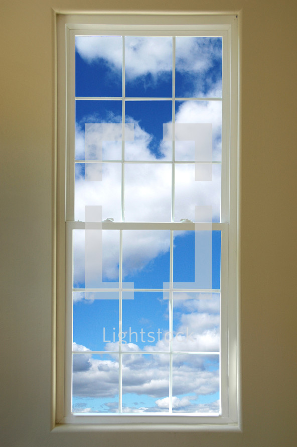 blue sky and clouds out a window 