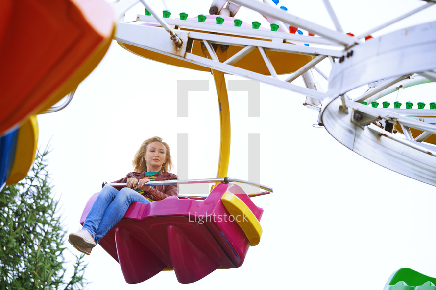 a woman on an amusement park ride 
