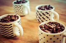 coffee beans in mugs 