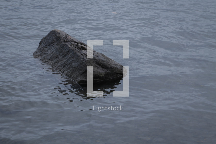 rock in a lake 