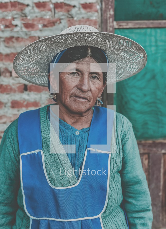 elderly woman in a straw hat 