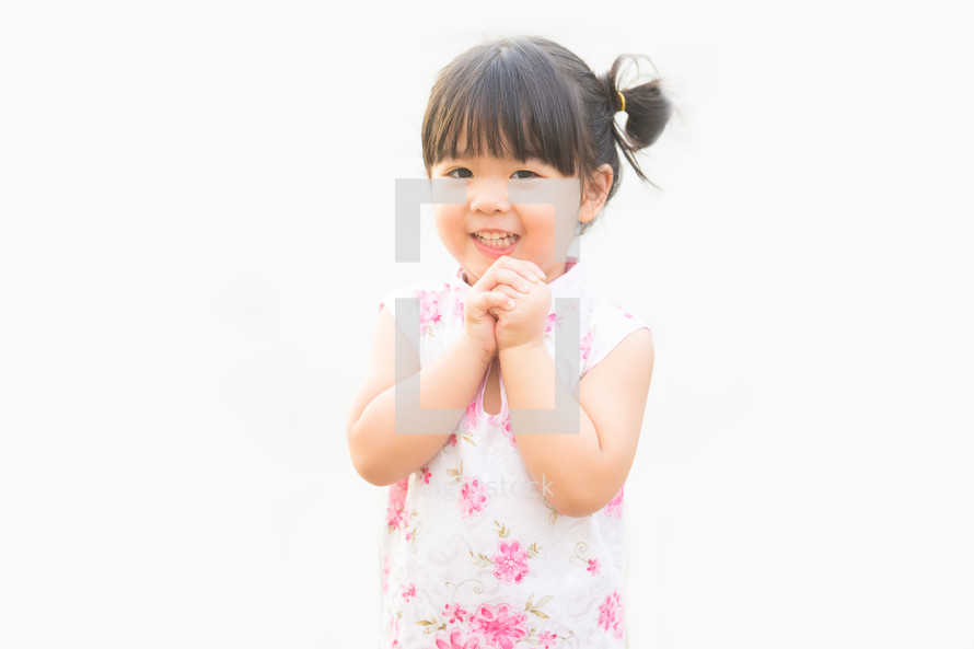 Happy Little asian girl in chinese traditional dress smiling. Happy chinese new year concept.