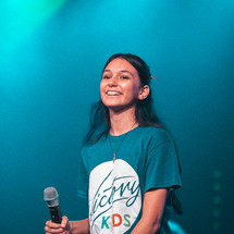 teen girl holding a microphone 