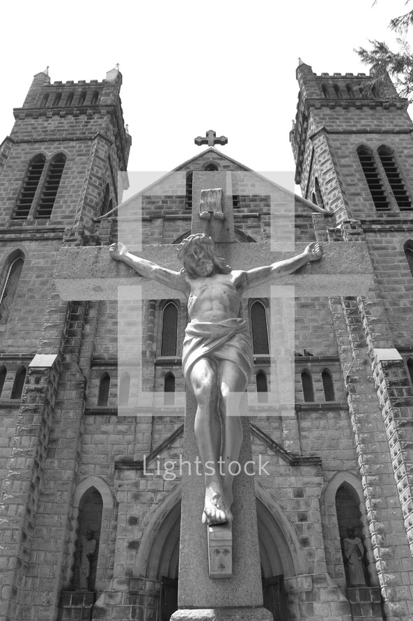 Jesus on the cross in front of a church 