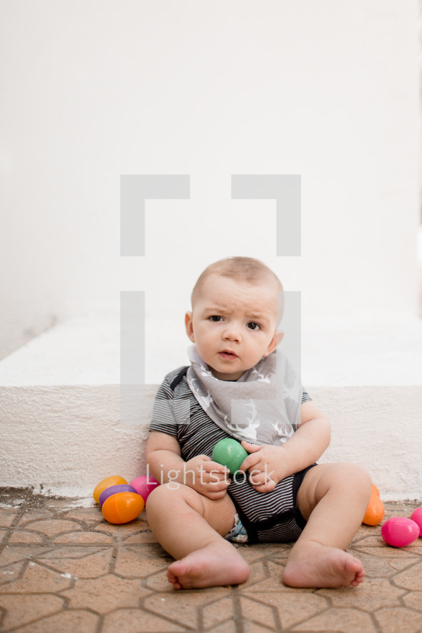infant boy with Easter eggs 