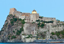 Aragonese Castle by night in Ischia island, Italy