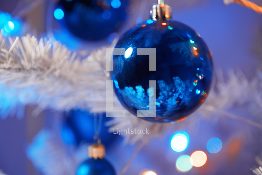 blue ornaments on a Christmas tree