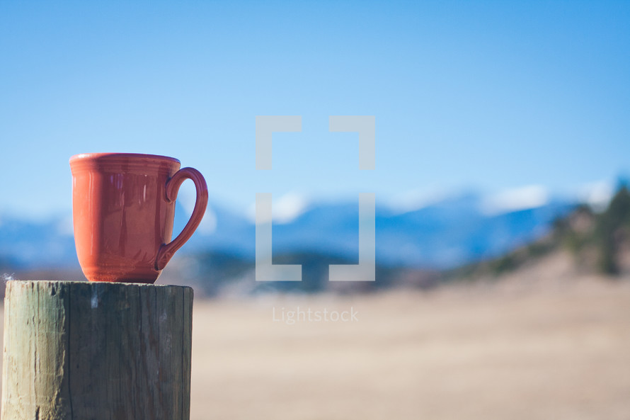 coffee mug on a post 