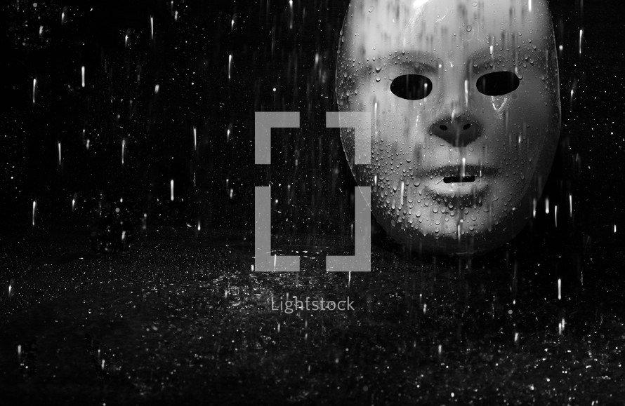 rain falling on a mask 