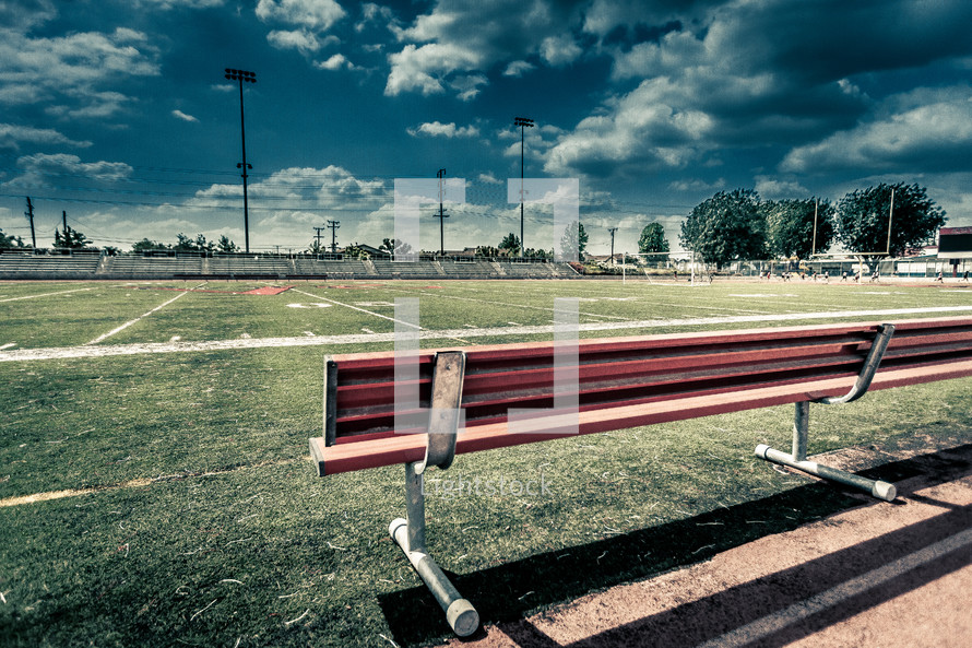 Bench on a football field.