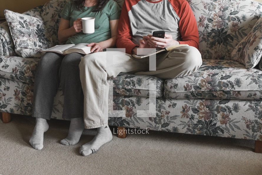 couple sitting on the couch watching church online