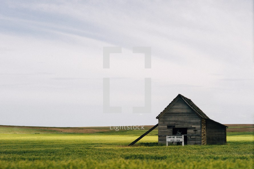 old barn in a field 
