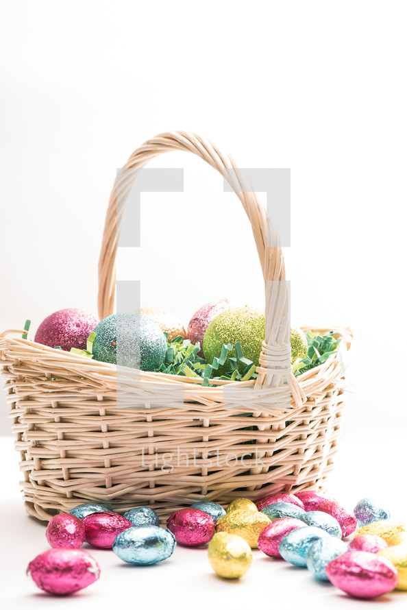 Easter basket with Easter eggs and candy 