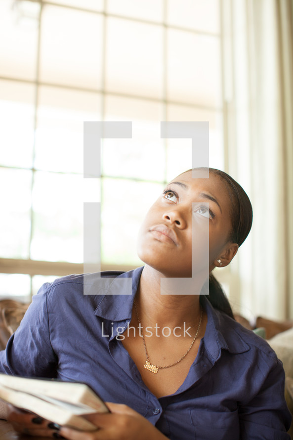 face of an african-american woman questioning God 