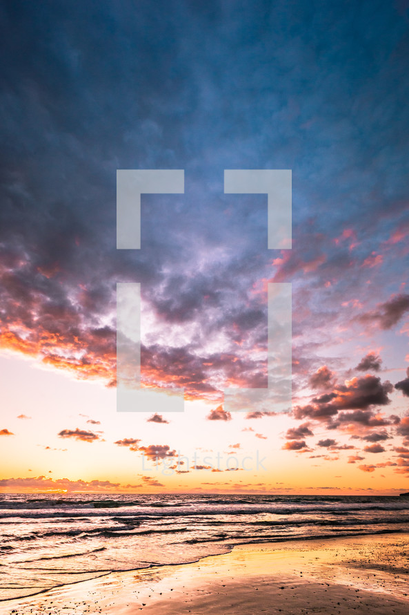 clouds over a shore at sunset 