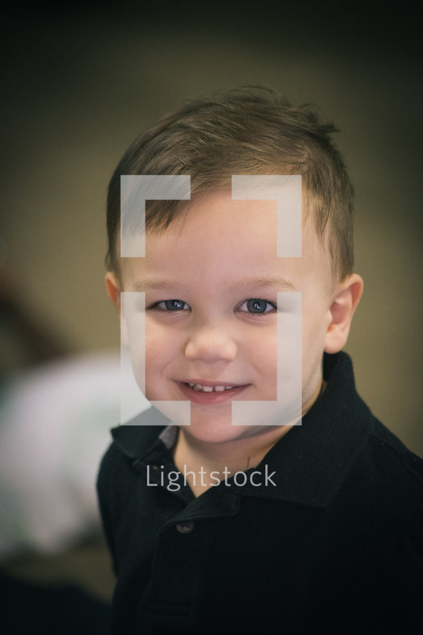 A smiling little boy.