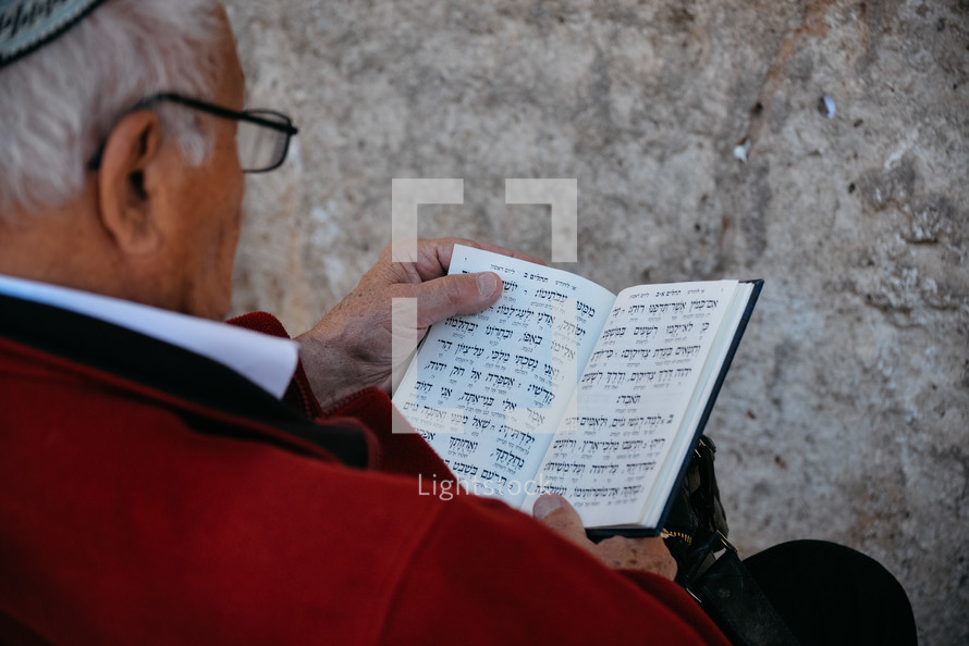man reading a Hebrew Bible 