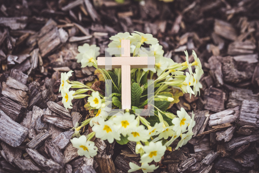 wood cross in flowers 