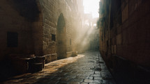 A low-angle shot of an empty street in Jerusalem in the early morning. Sunlight eliminated the street and lights up the cobblestones. 