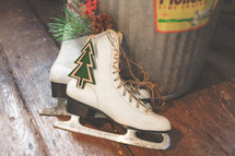 Christmas or winter decorations stock photo featuring ice skates ideal for a social media post idea, presentation slide background or church bulletin cover.