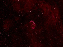 A red nebula in outer space that resembles an egg