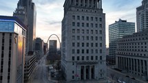 Aerial view panning through business buildings in downtown Saint Louis, Missouri.