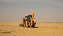 a bulldozer in the desert 