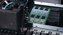 Surface Mount Technology (Smt) Machine places resistors, capacitors, transistors, LED and integrated circuits on circuit boards at high speed