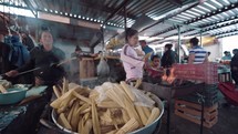 women cooking tamales in Mexico 