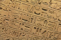 Egyptian hieroglyphics set in clay