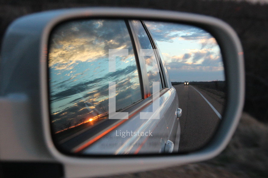 view in a side mirror of a car 