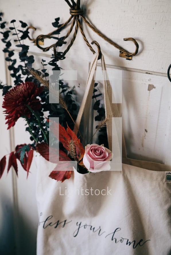 flowers in a bag hanging on a hook 