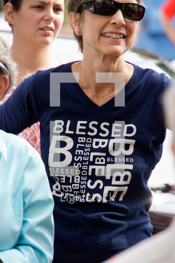 a woman wearing a blessed t-shirt 
