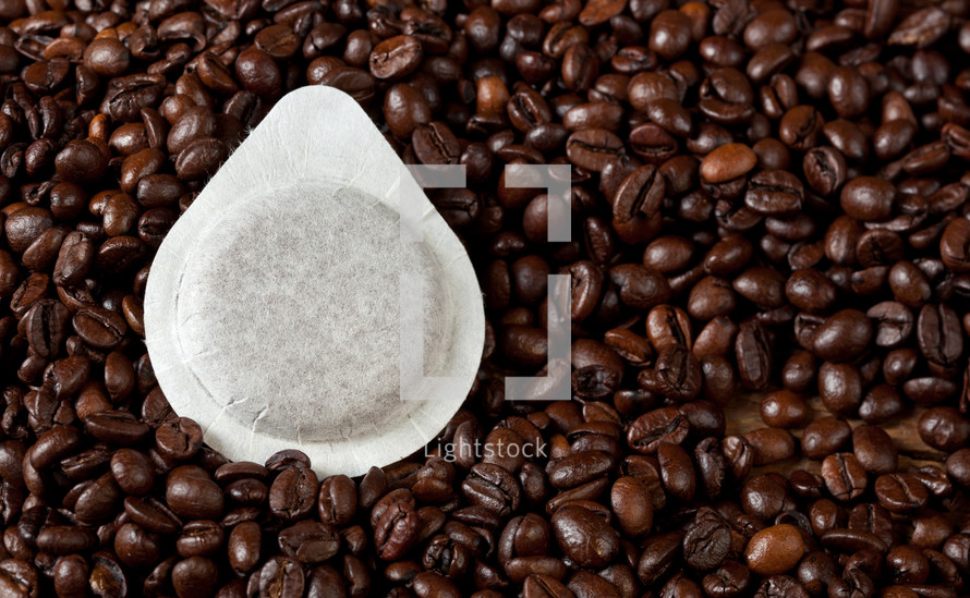 coffee pod on coffee beans 